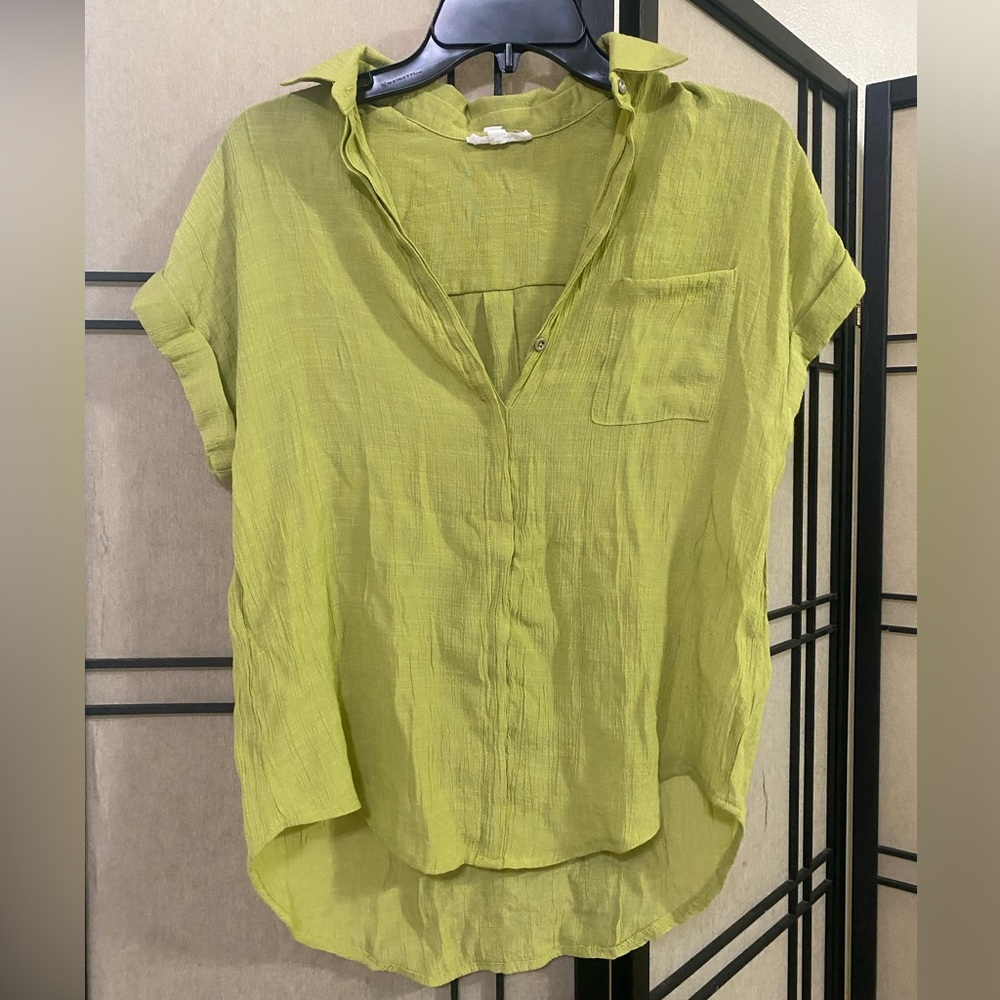 Green blouse.